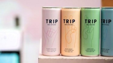 Four different colour cans of TRIP CBD drinks